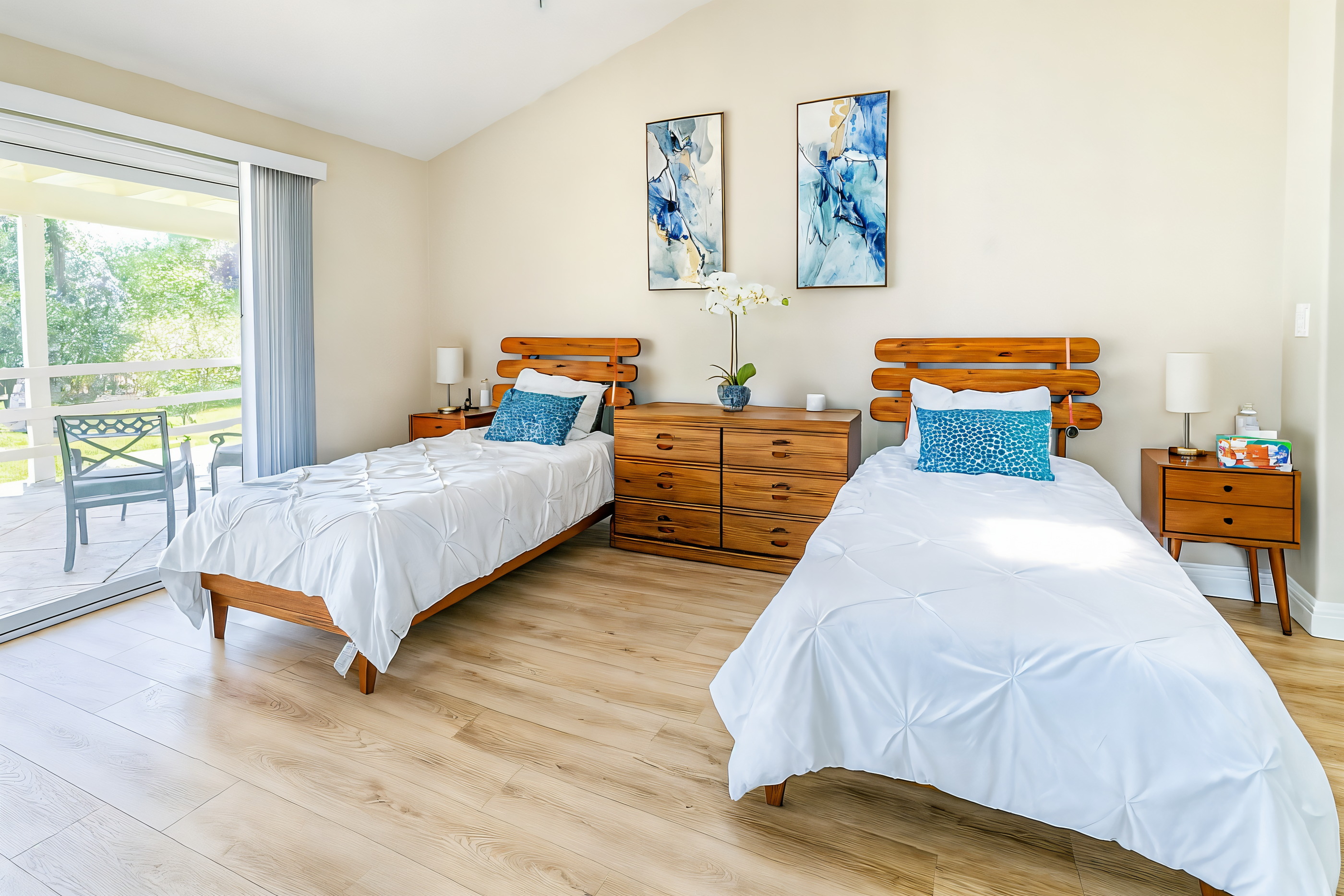 A bright, light-filled bedroom at Balanced Living opening to the garden